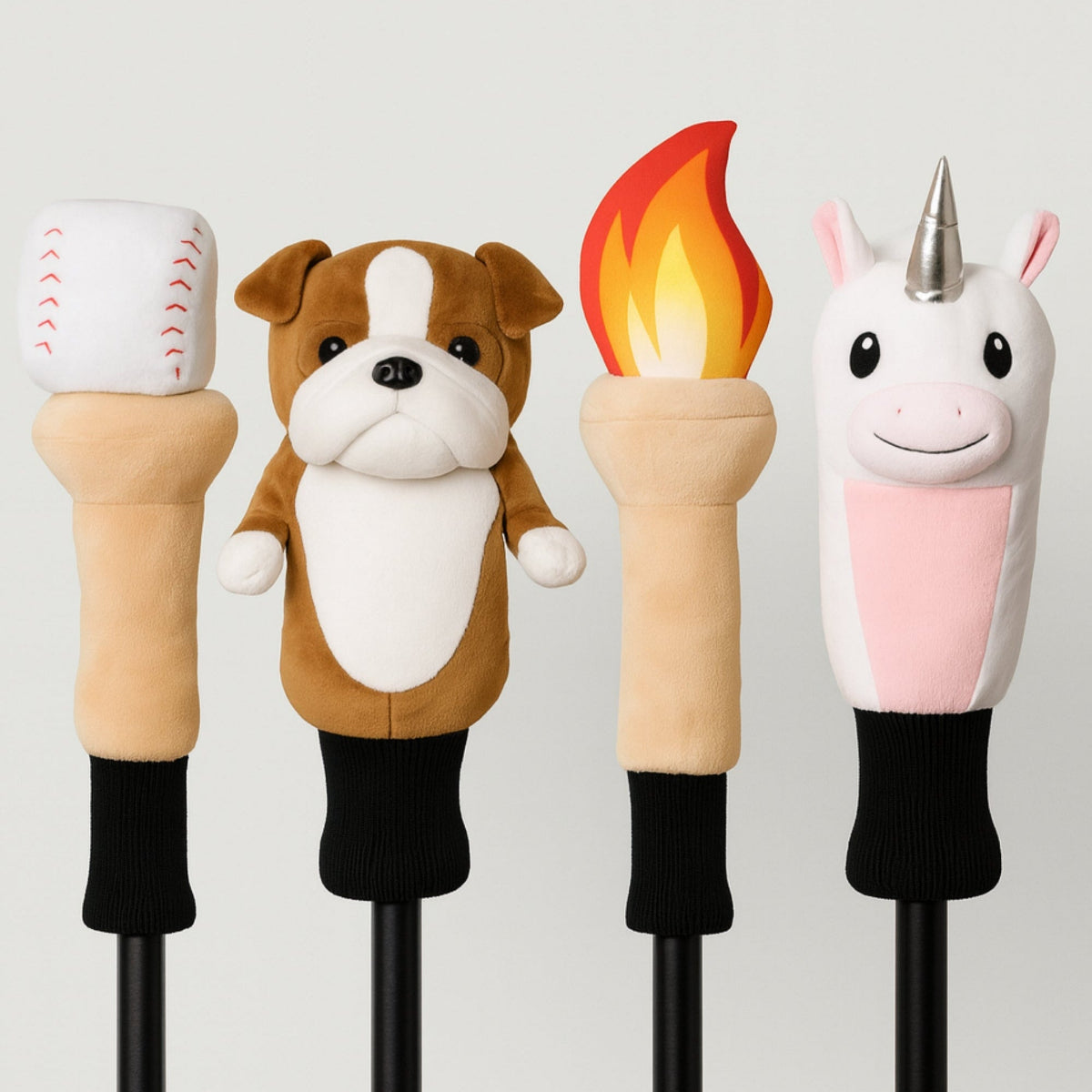 Four novelty golf club heads with animal and themed designs on a light gray background.