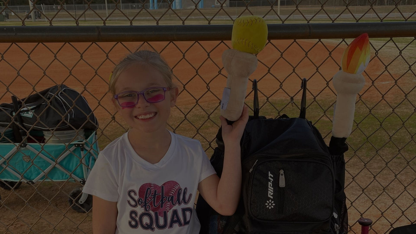 Youth softball player with her Bat Hats bat covers