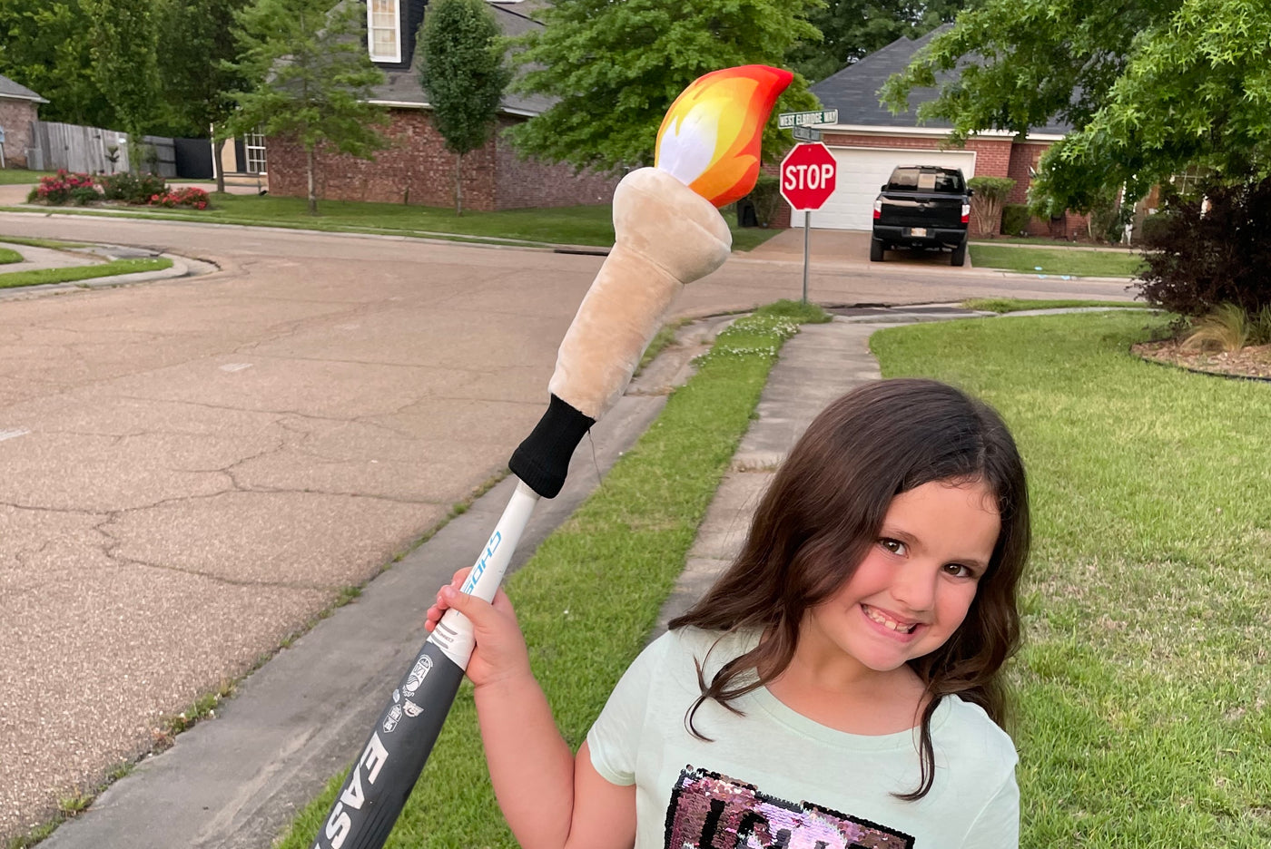Young girl with softball Bat Hat bat topper