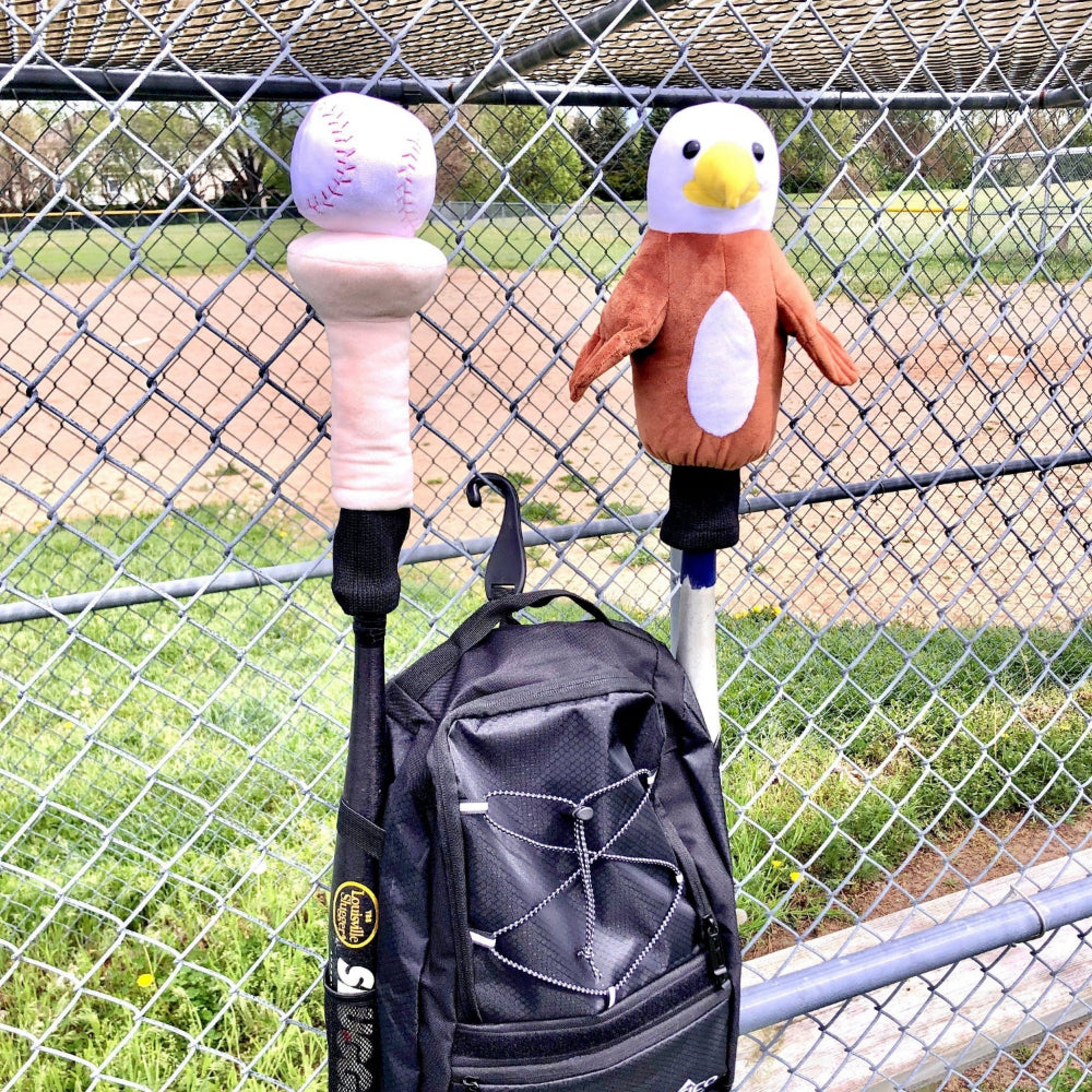 Baseball backpack in dugout with baseball and Eagle Bat Hats bat covers
